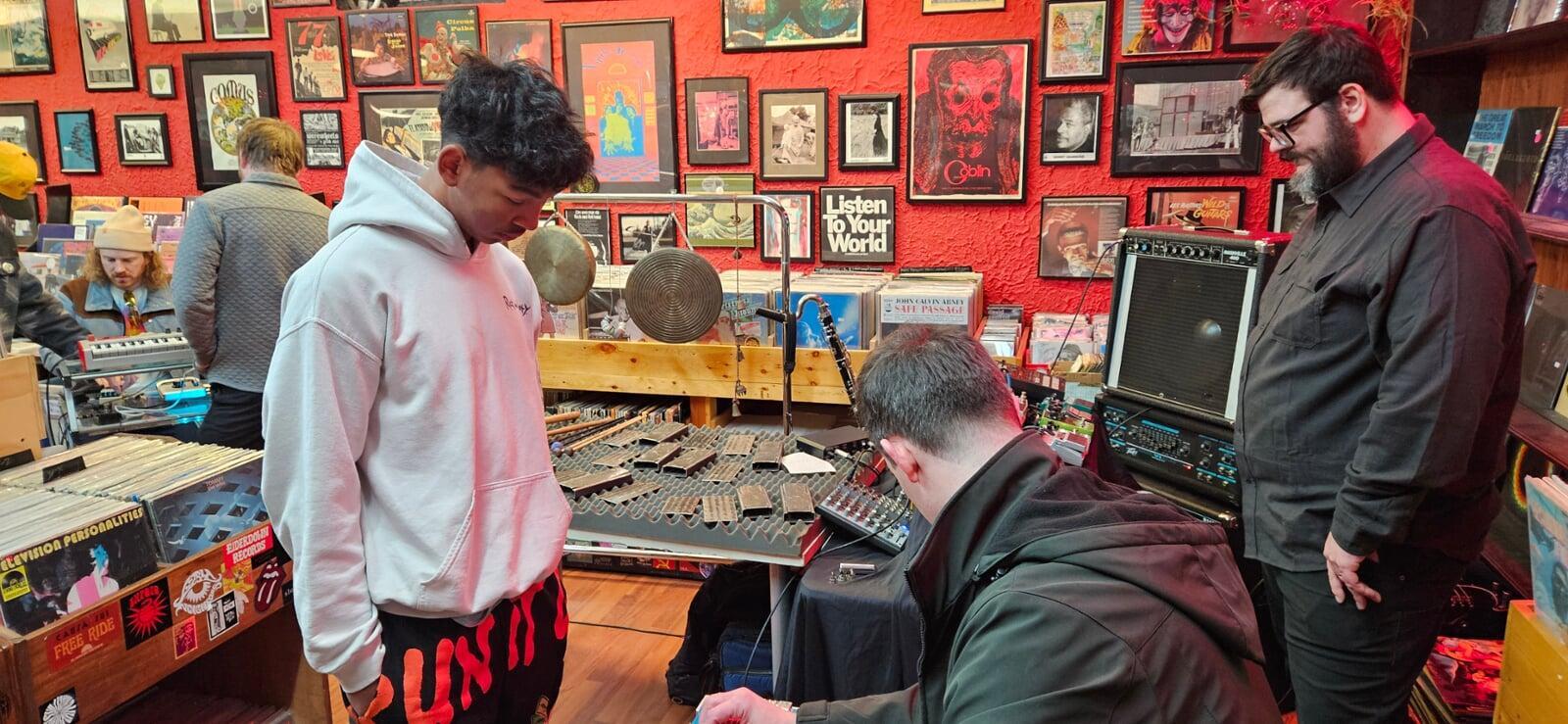Nate shows Markell how to play the pedal steel